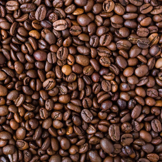 A close-up image of roasted coffee beans filling the entire frame from an Ethiopian roast.